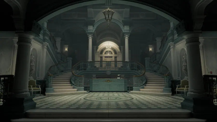 Grand staircase in a classical building with columns and chandeliers.